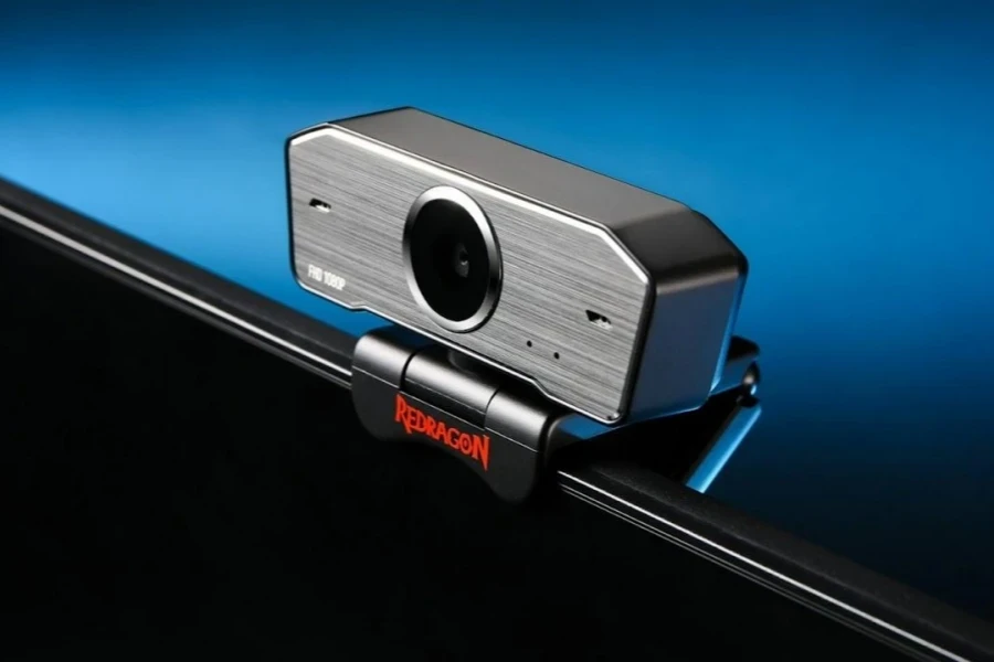 A black and silver webcam on a laptop display