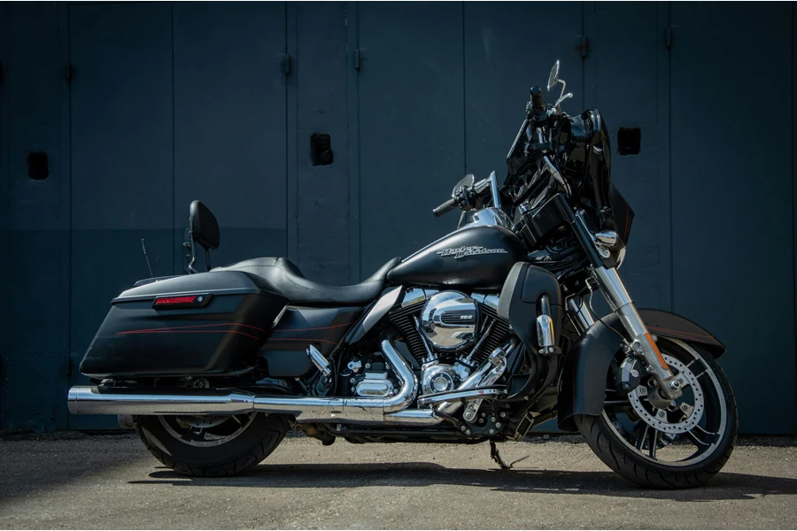 A black motorcycle parked in front of a building