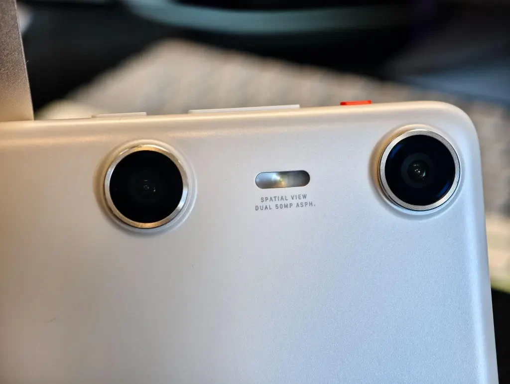 A close-up of the dual JN1 lenses on the back of the XREAL Beam Pro device.