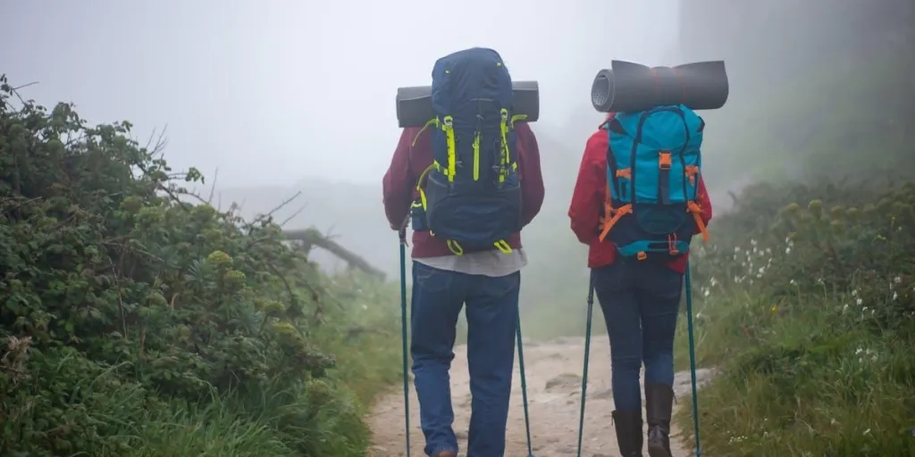 A couple hiking with walking sticks