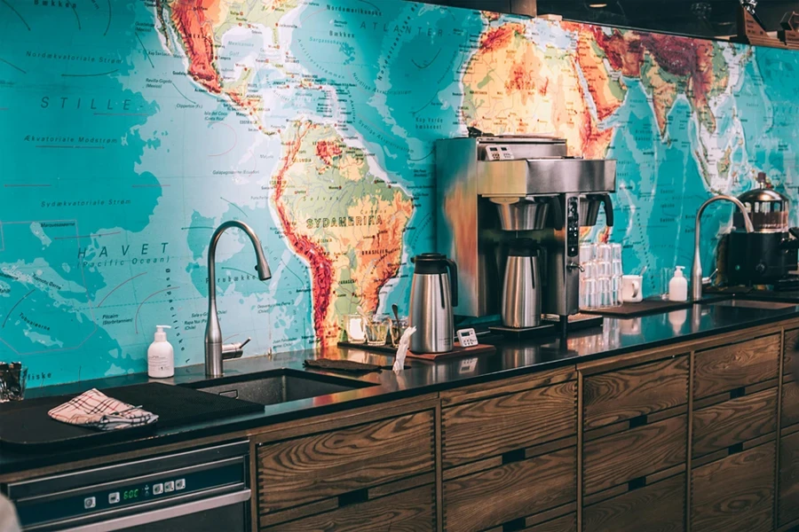 A kitchen with a map of the world