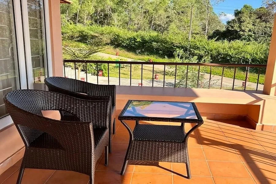 A patio with a table and chairs