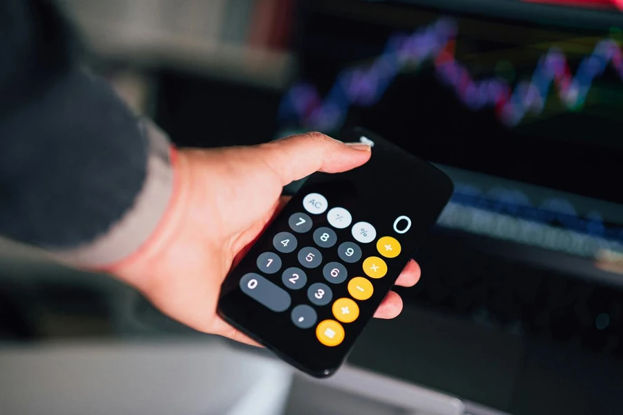 A person holding a calculator