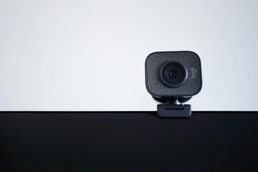 A small black webcam on a laptop