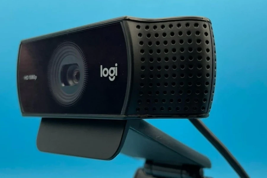 A webcam with a built-in microphone on a blue background