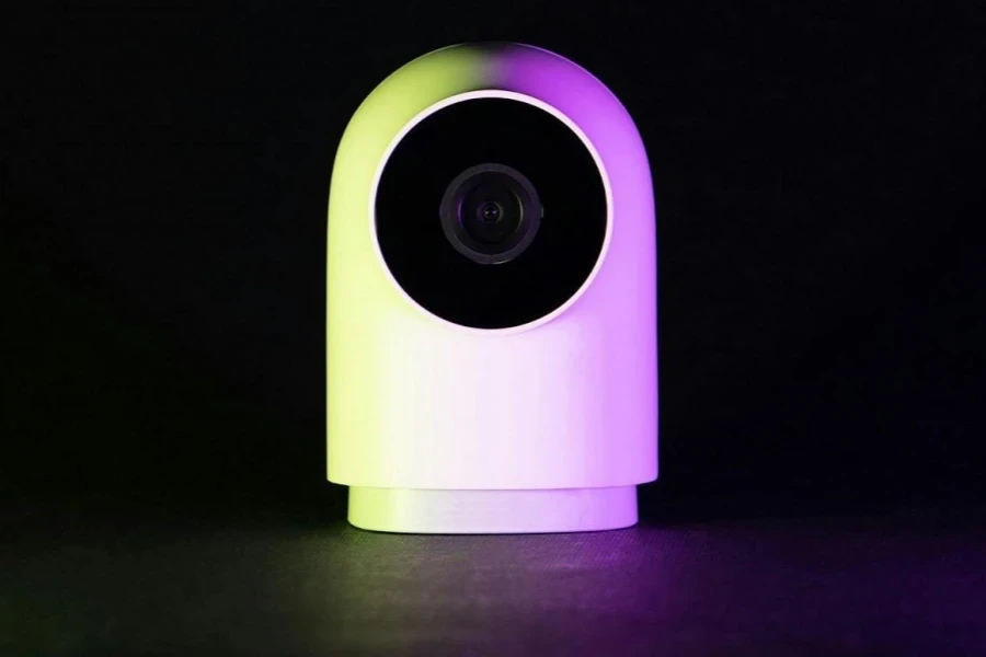 A white webcam against a black background