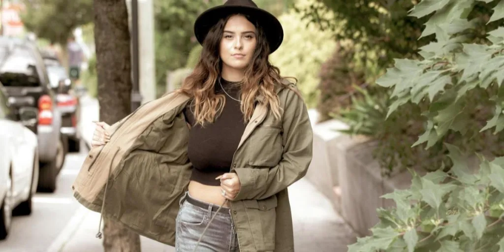 A woman in a stylish jacket walking on a street