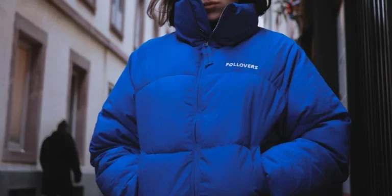 A woman in blue full zip rain bubble jacket