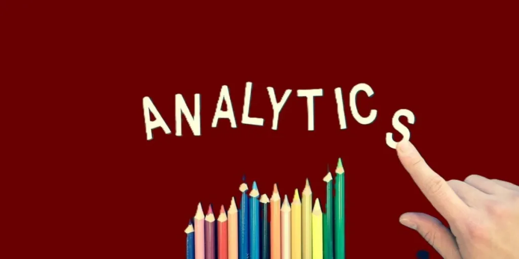 An illustration of “ANALYTICS” on a red background