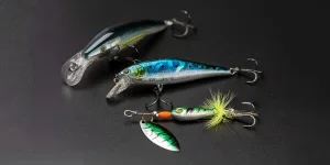 Artificial baits for catching of the predatory fishes on black background