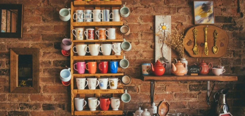 Assorted-color Mugs on Brown Wooden Floating Rack