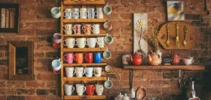 Assorted-color Mugs on Brown Wooden Floating Rack