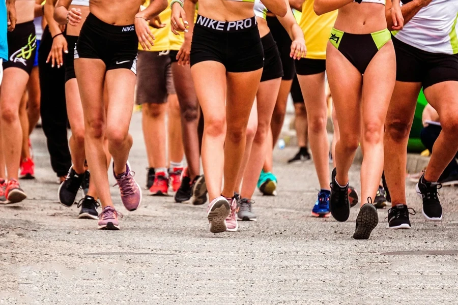 Athletes running a Summer marathon with trail running shoes