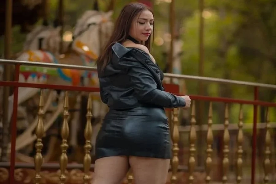 Beautiful lady in a leather jacket and miniskirt