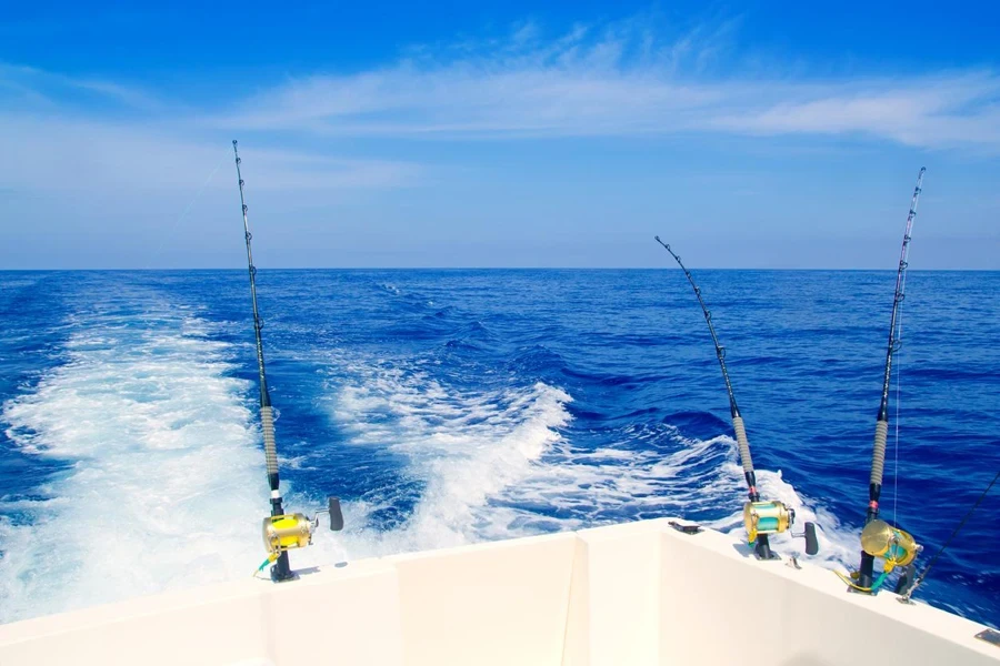 Boat fishing trolling in deep blue sea