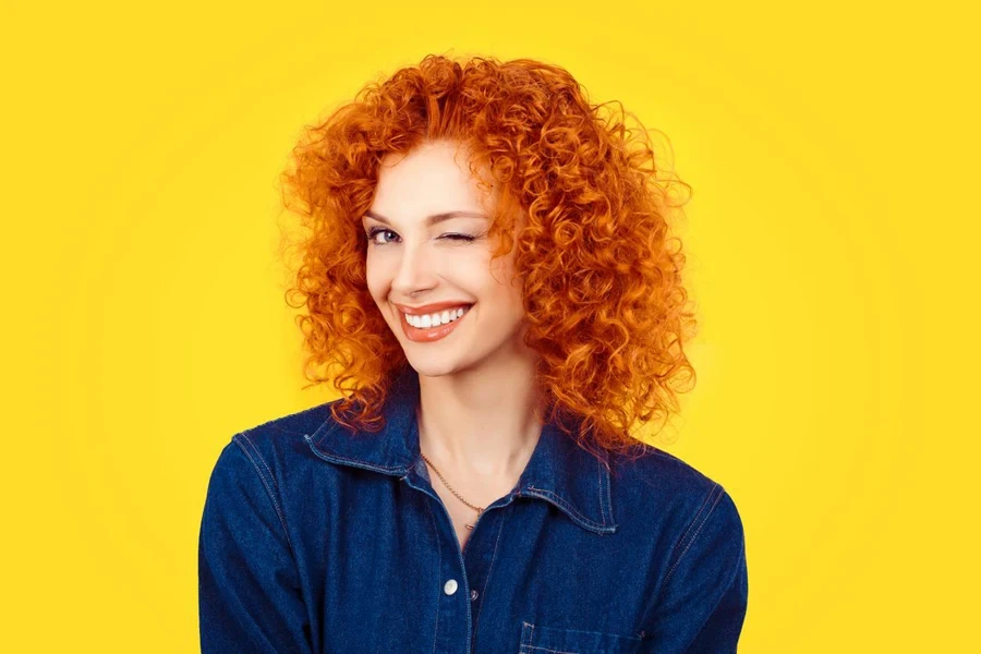 Closeup woman with curly hair smiling