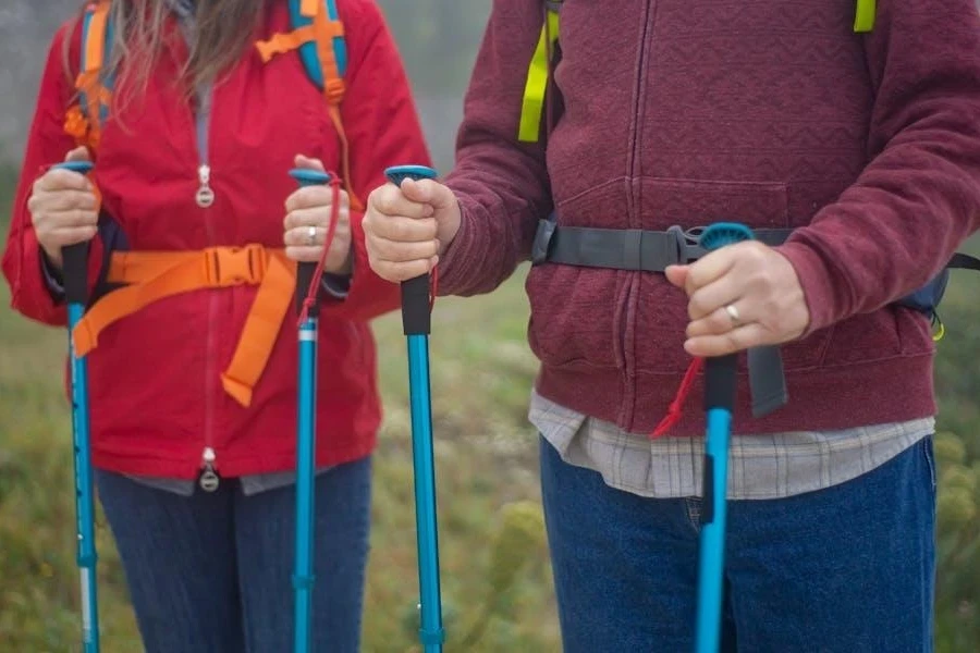 Couple posing with adjustable walking sticks