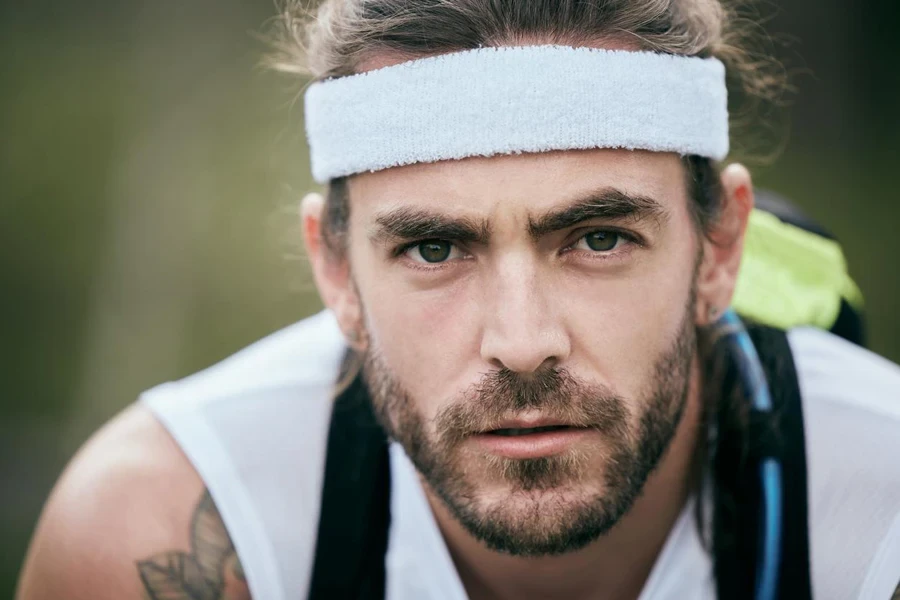 Cropped portrait of a handsome young male athlete taking a break