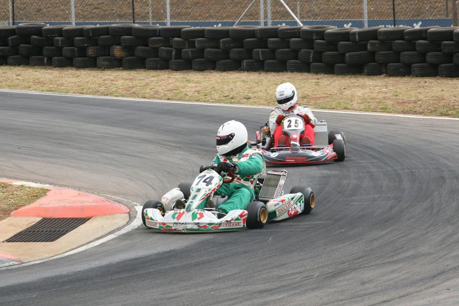 Drivers Racing in Go Karts on a Circuit