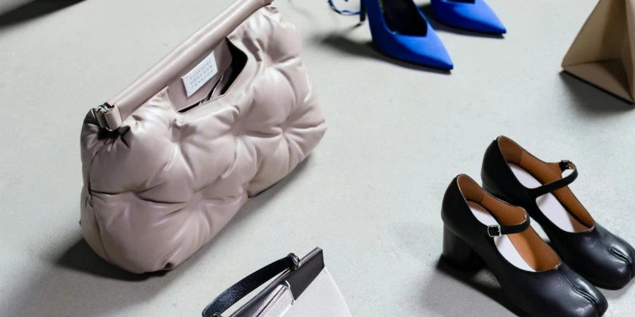 Elegant Shoes and Bags Standing on White Surface