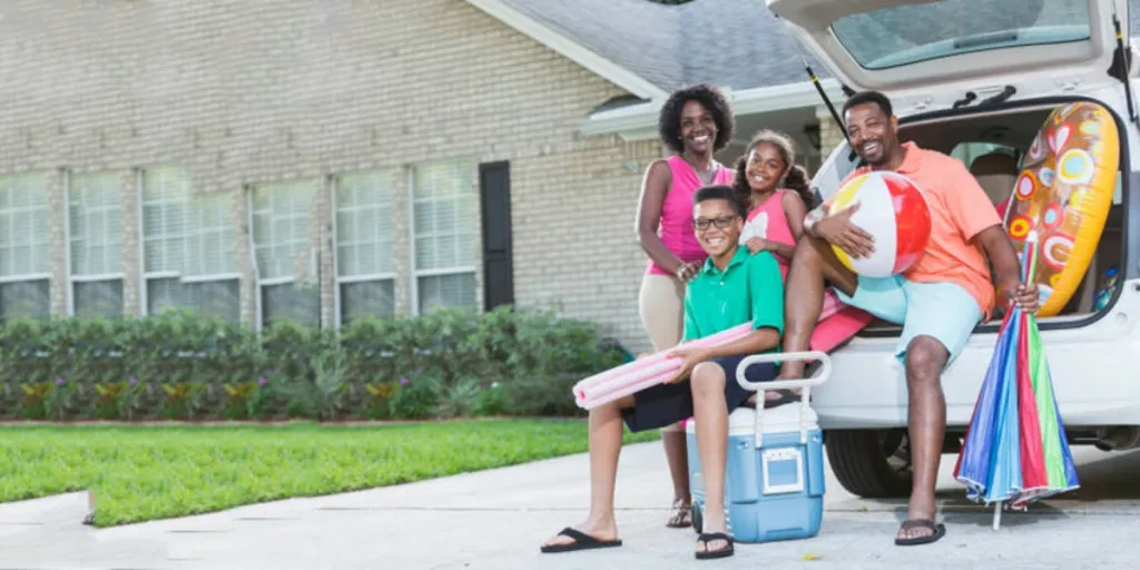 Family packing car with 60-quart cooler with wheels