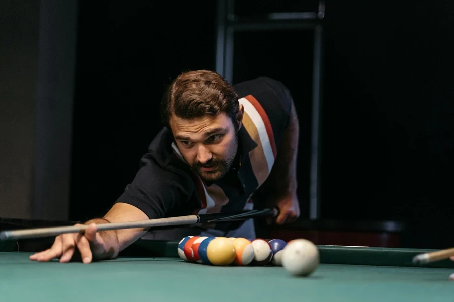 Focused Man playing Billiards