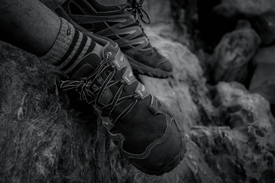 Grayscale Photo of Hiking Shoes
