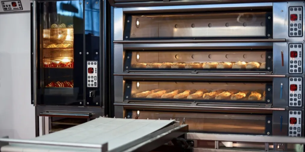 Industrial convection oven with cooked bakery products for catering