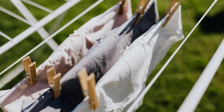 Linen with Clothespins Attached to Rail in Yard