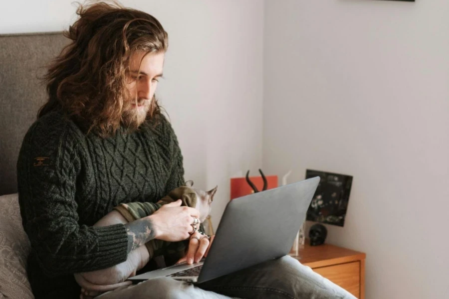 Man Sitting on Bed