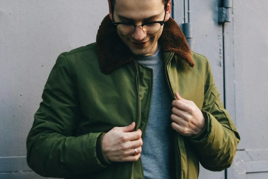 Man in a green Harrington jacket