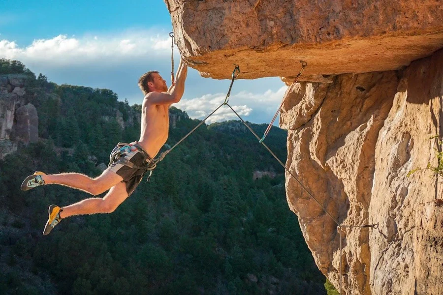 Man mountaineering with a climbing harness