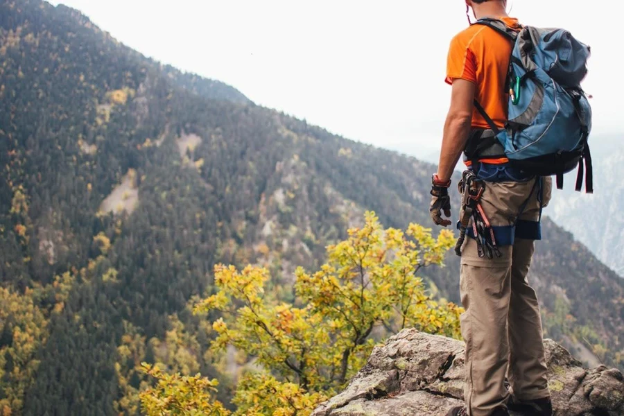 Man standing on a hill after traditional climbing