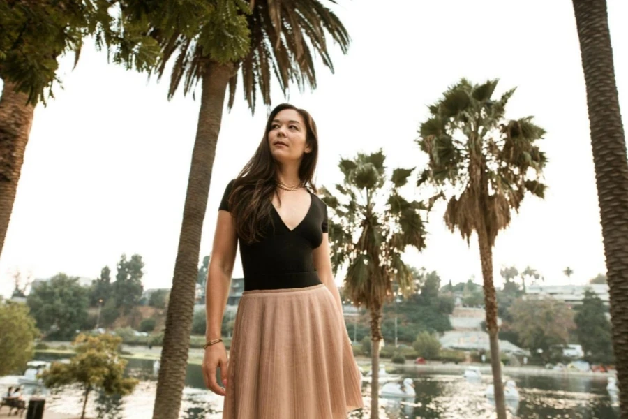 Model in Skirt among Palm Trees