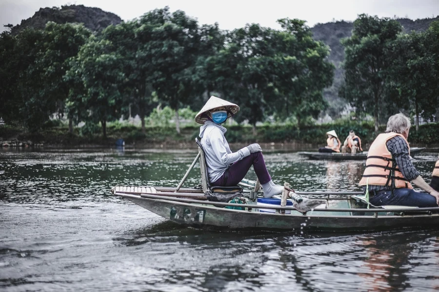 People Riding on Boat on River