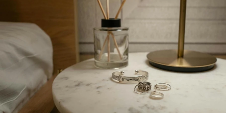 Photo of Rings and a Bracelet on a Bedside Table