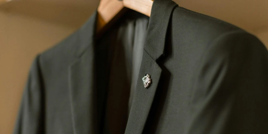 Photo of a Black Suit with a Badge, on a Hanger