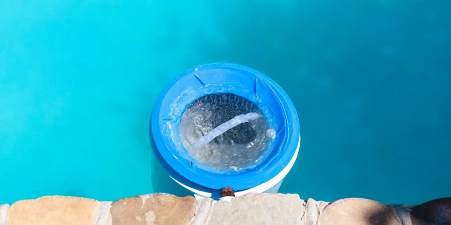 Plastic water filter near wall of swimming pool