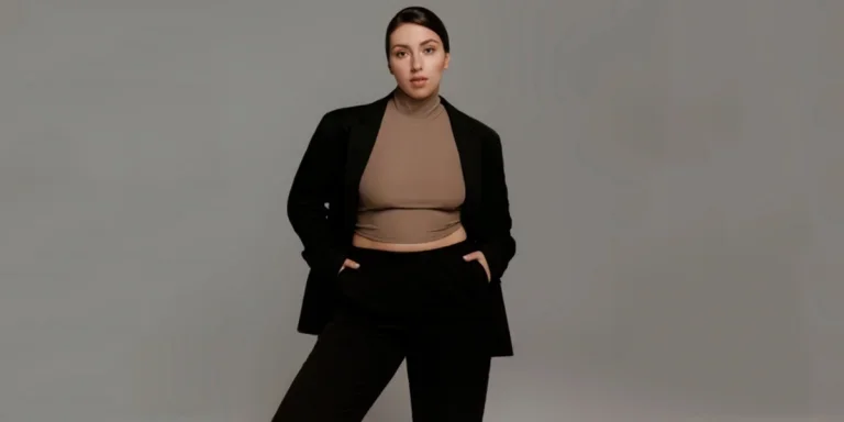 Plus size woman in black pants suit and brown t-shirt