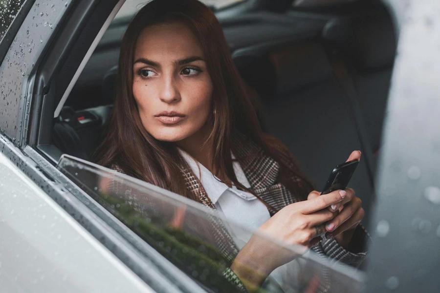 Portrait of Brown Haired Woman Sitting in Car