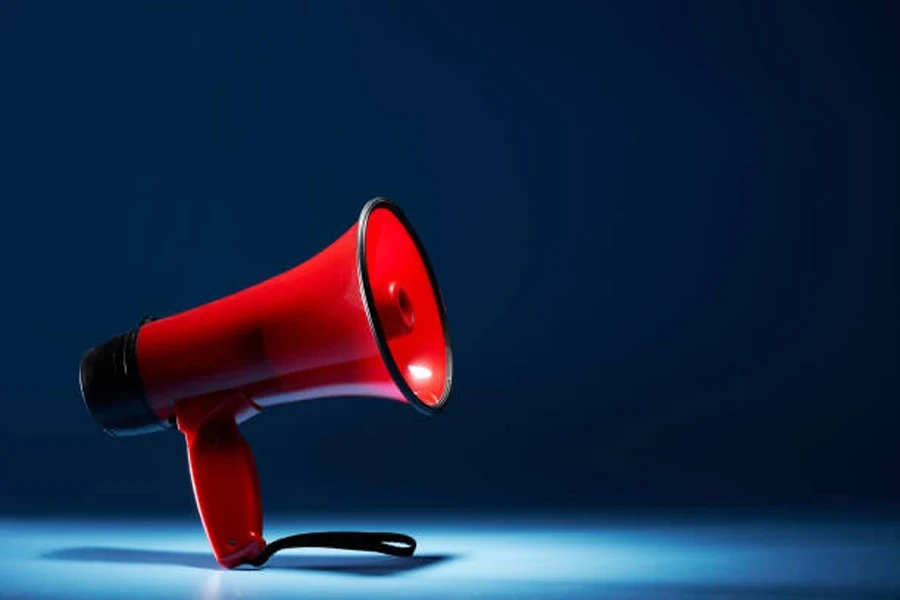 Red speaker megaphone with black wrist strap on bottom