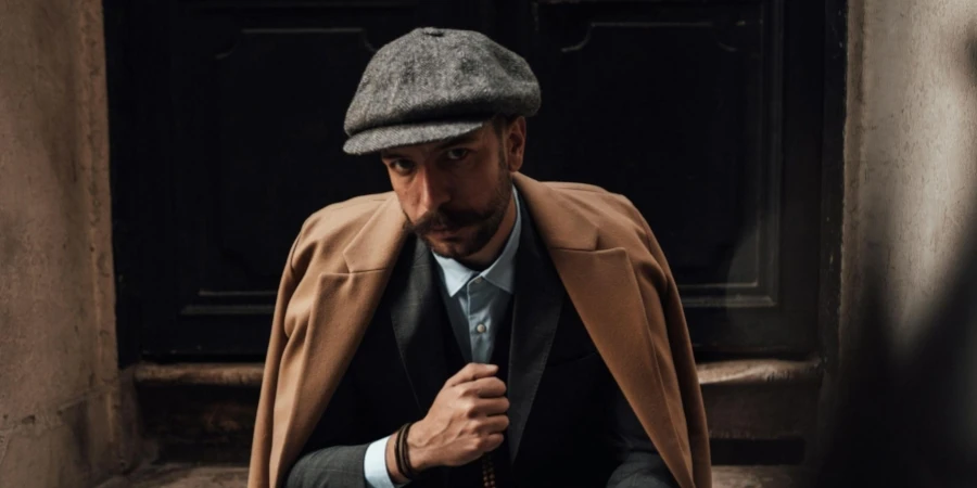 Stylish Man in Suit Sitting on Stairs