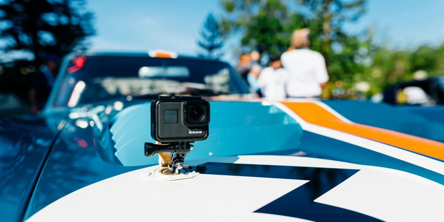 The mini camera Gopro is placed on the hood of the car