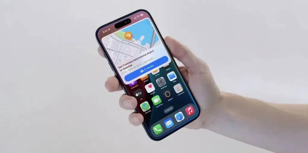 The route navigation is displayed on the Apple phone in hand