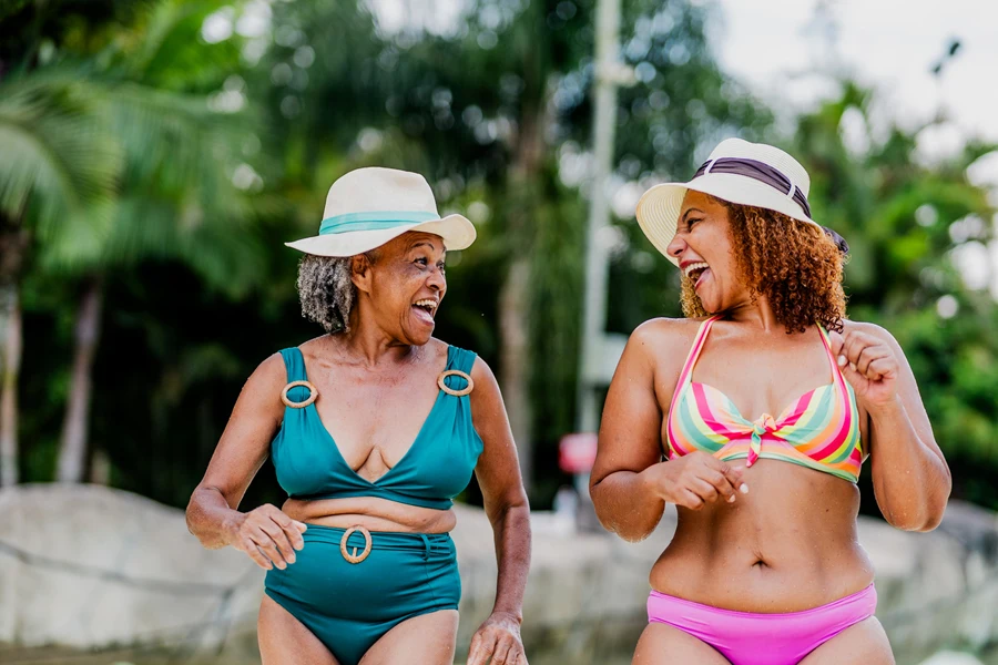 Two mature women in two-piece swimwear for fuller figures