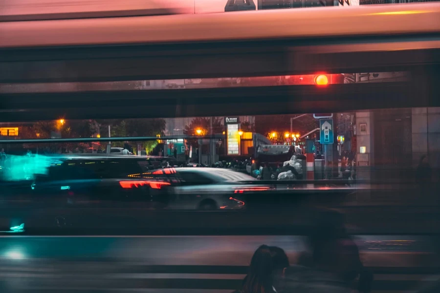 Vehicles Passing on Road at Night