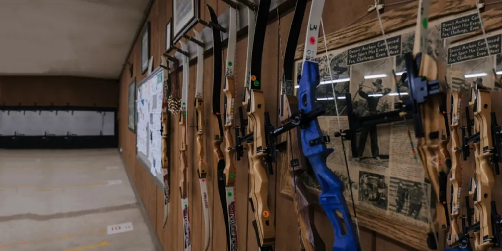 Wall lined with different types of bows with release aids