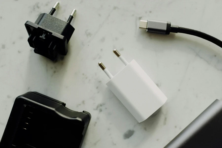 White And Black Adapter On White Surface