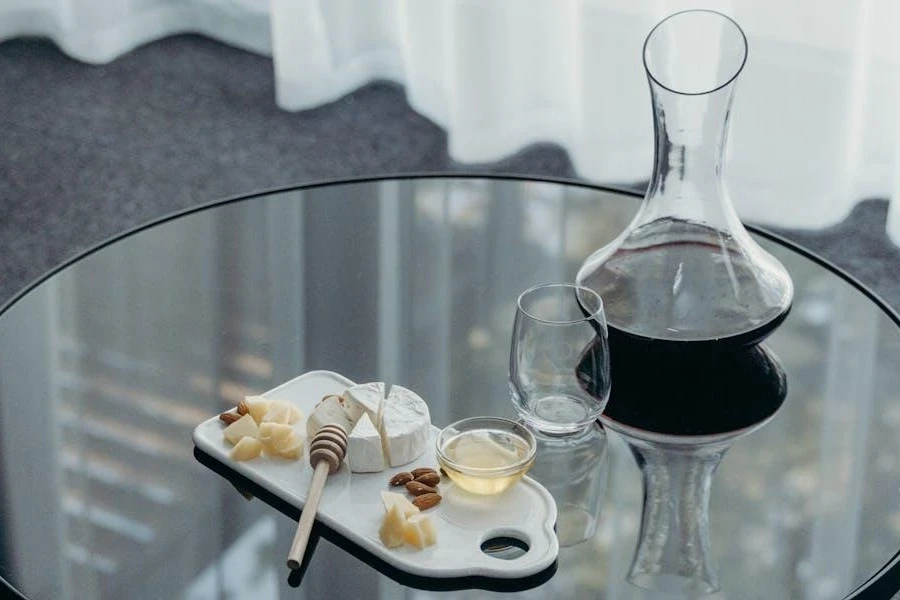 Wine in a decanter and cheese board on a table