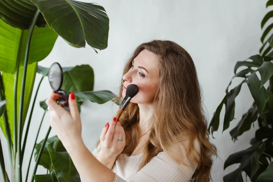 Woman Putting on Blush